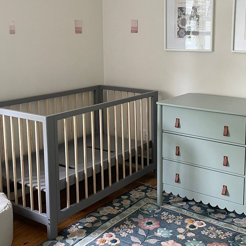 Nursery furniture — cot and storage in a calm baby's room