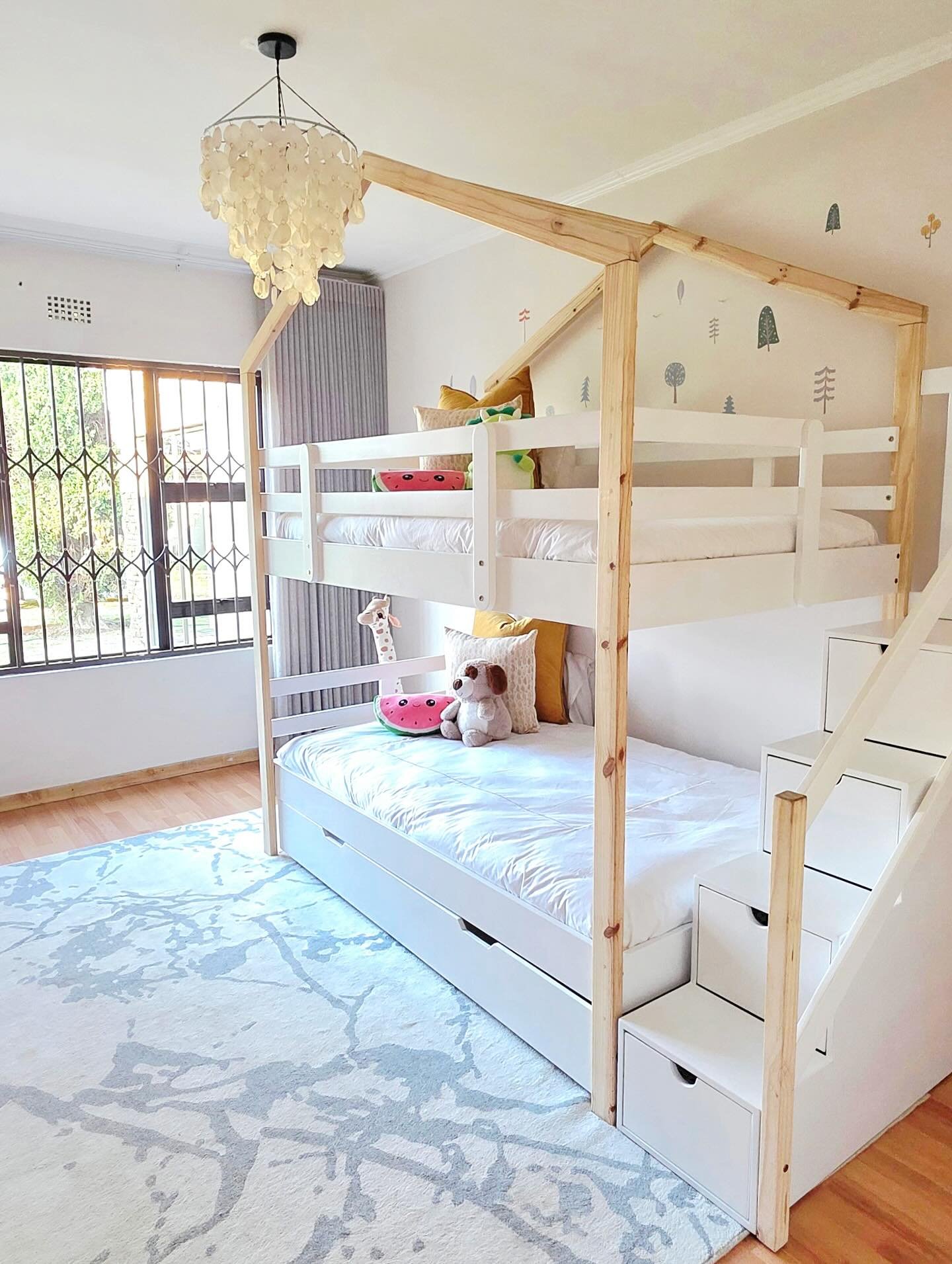 Shared children's bedroom with bunk bed and individual storage